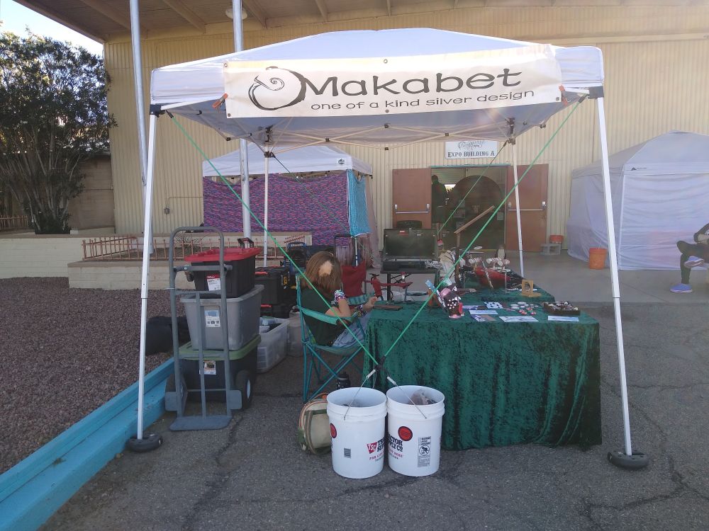 My booth and a teen helper.