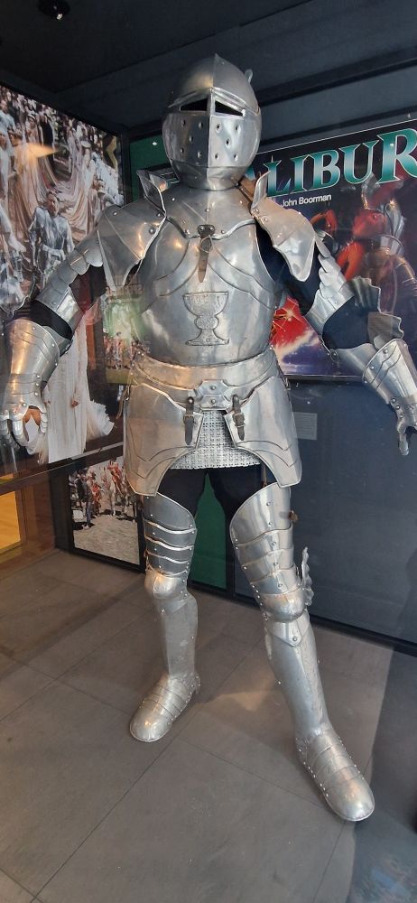A shiny suit of armour with a stupid Grail shaped icon on the breastplate