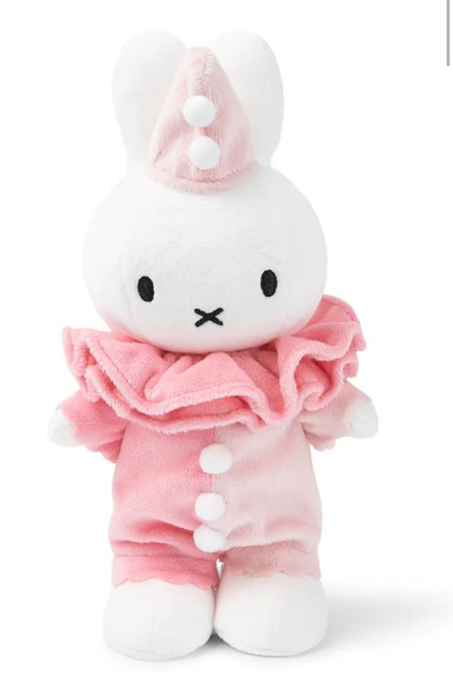 screenshot of a miffy plush that is dressed like a pink and light pink clown, she has a frilly neck and a hat!