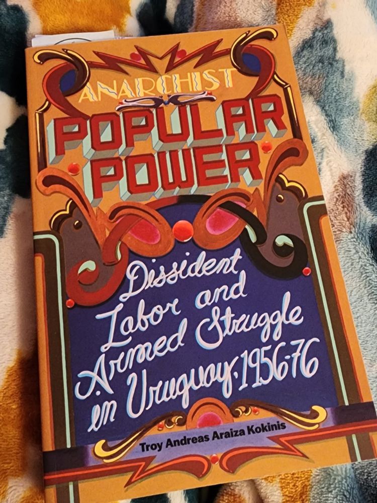 Photo of a book titled "Anarchist Popular Power: Dissident Labor and Armed Struggle in Uruguay, 1965-76" by Troy Andreas Araiza Kokinis