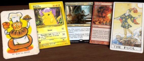 Mr Bun the baker, Pikachu, shadowmage, a fireball spell and the fool. Cards in a hand.