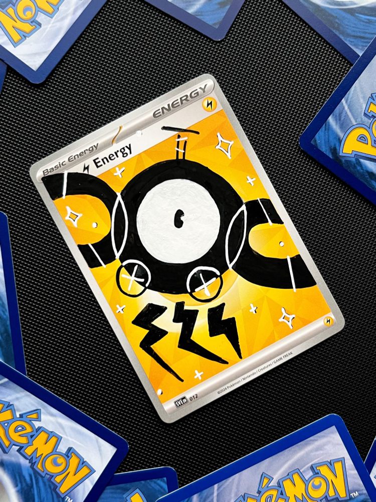 A pokémon TCG electric energy painted over with a minimalistic retro inspired Magnemite. It's drawn in black, with white for features. Underneath it are three bolts of lightning, and it's surrounded by sparkles.