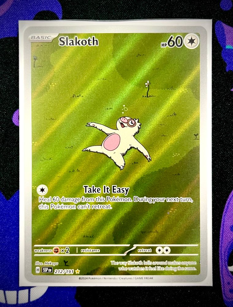A Pokemon illustration Rare card of Slakoth, a little sloth, just chilling. It says Basic - Slakoth - hp60 - Take it Easy: heal 60 damage from the Pokemon, during your next turn this Pokemon can’t retreat.