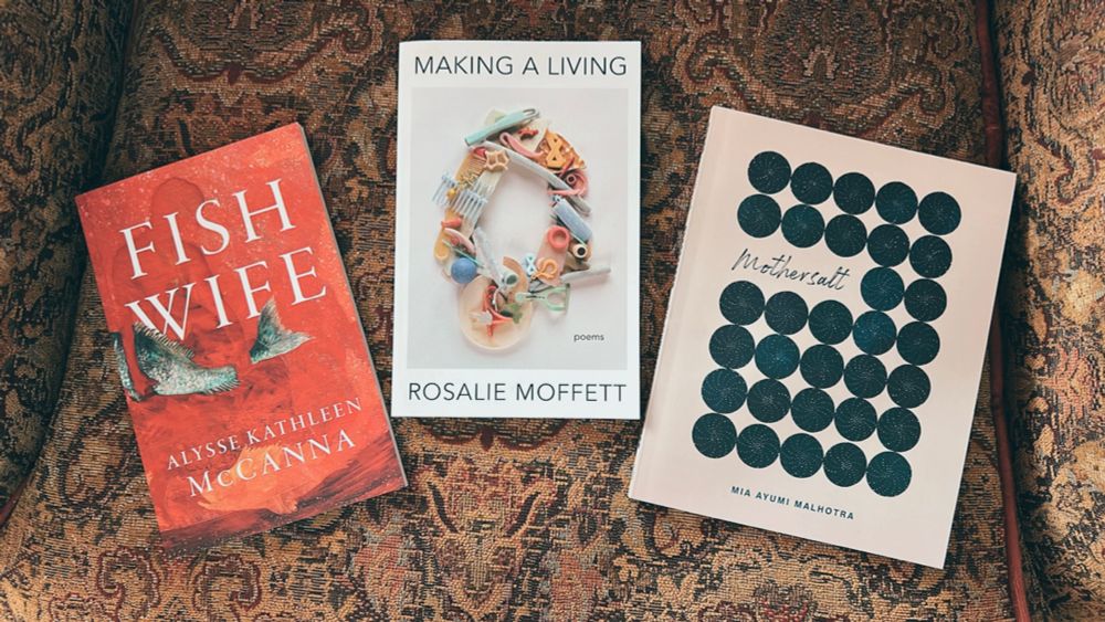 Three books on a paisley print chair: FISH WIFE by Alysss Kathleen McCanna, MAKING A LIVING by Rosalie Moffett, and MOTHERSALT by Mia Ayumi Malhotra