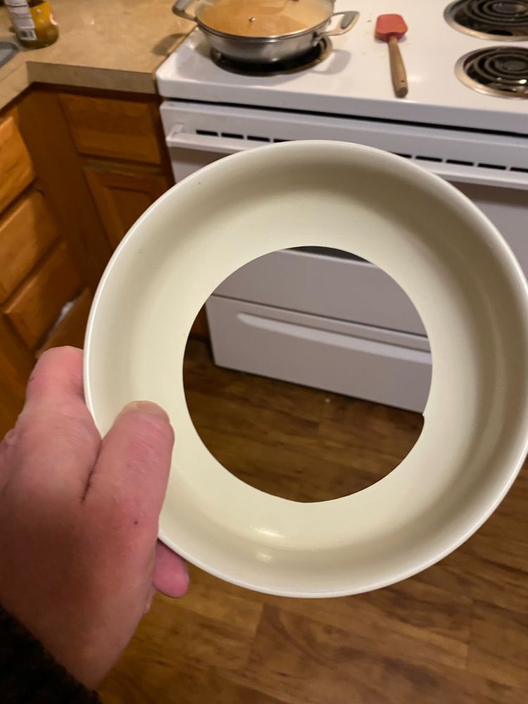 A bowl with an almost perfect hole in the bottom