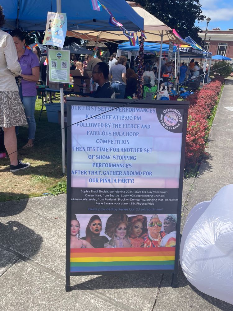 Sandwich board of schedule performances at Twin City Pride