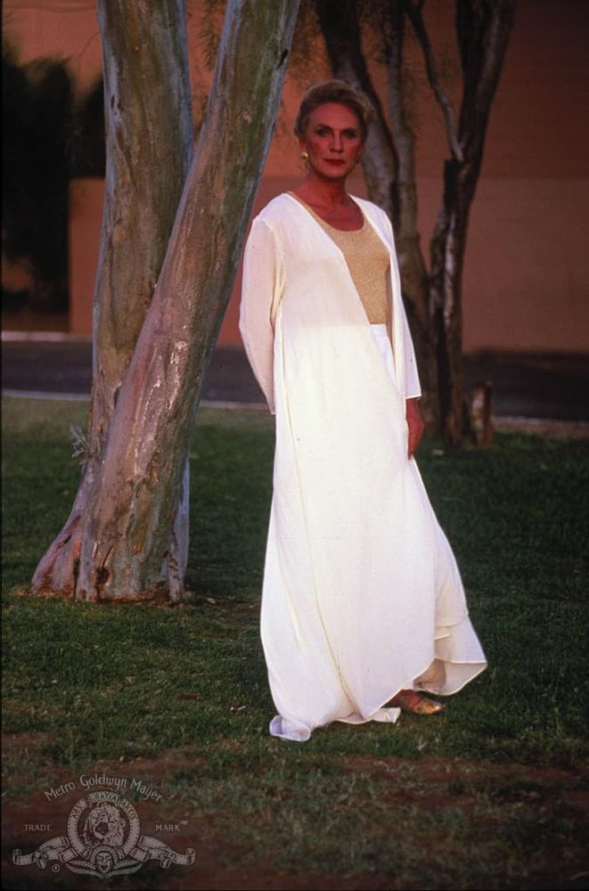 Terrence Stamp wearing a white dress for his role in Priscilla 