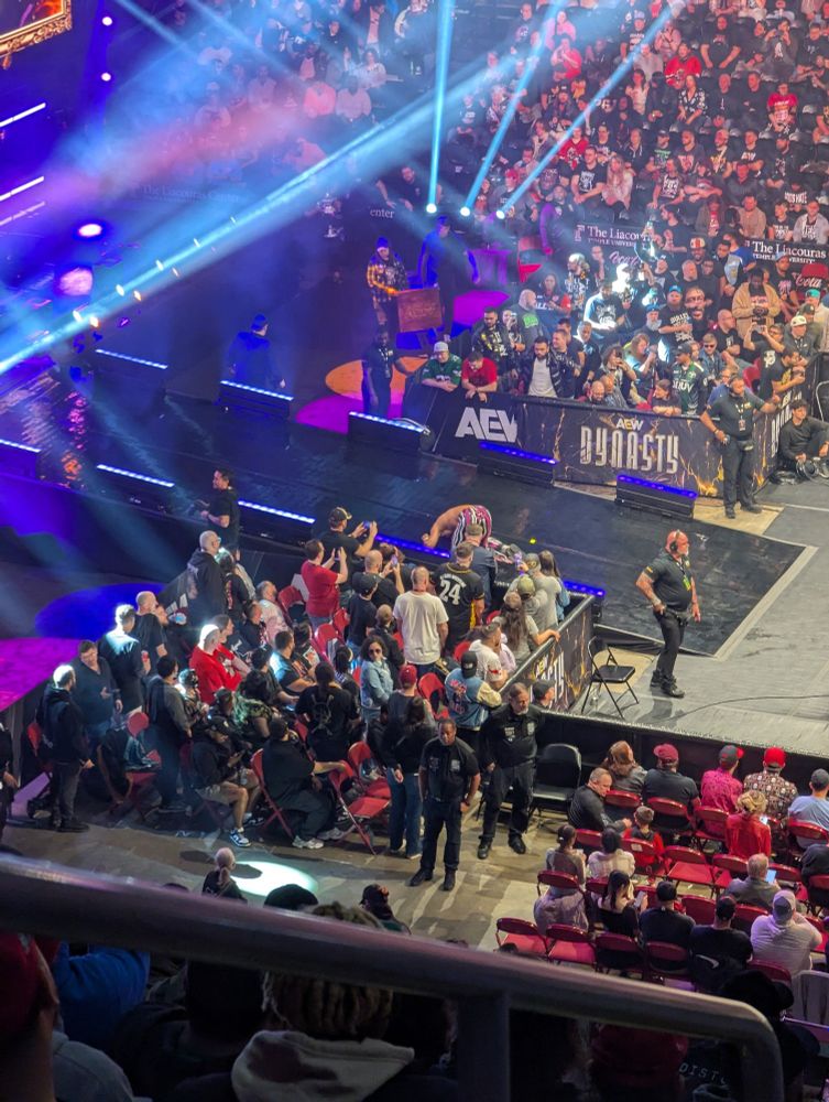 Max Caster about a third up the ramp on hands and knees trying to leave the arena.