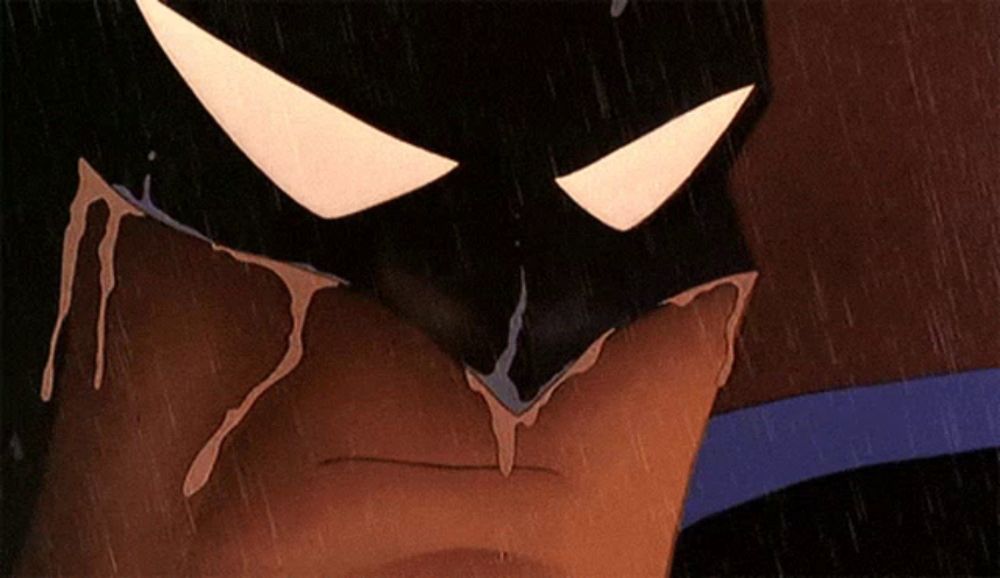 a close up of a cartoon character 's face with tears coming out of his eyes