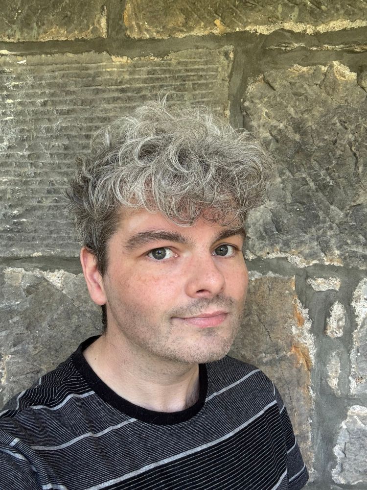 A selfie of a man with grey hair