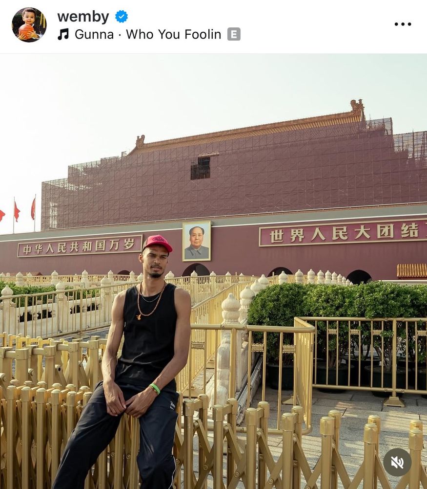 Victor Wembanyama in China posed in front of a Mao portrait