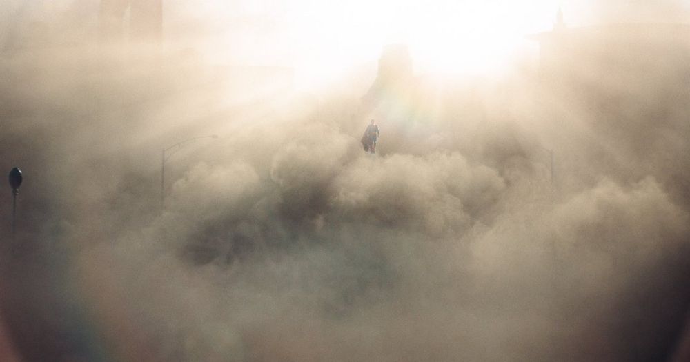 Superman floating in front of a huge dust cloud from the distance. Pure aura farming