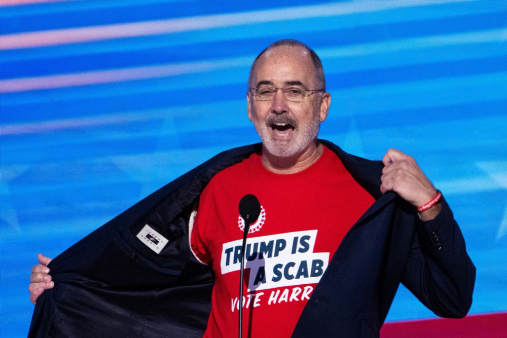 Shawn Fain wearing a “Trump is a Scab” shirt at a Harris rally in 2024
