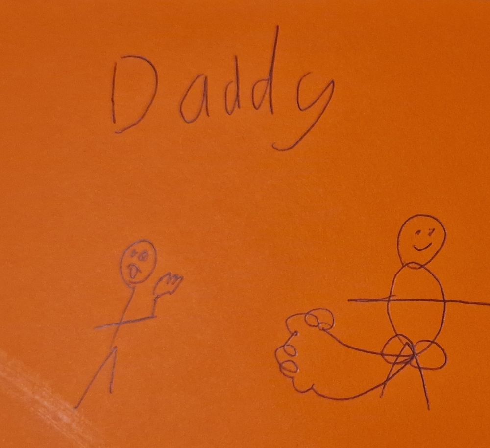 A stick figure doodle by my daughter, of me, with a giant bum producing a cloud of fart while another stick figure - presumably my daughter - is waving her hand with glazed eyes and sticking her tongue out