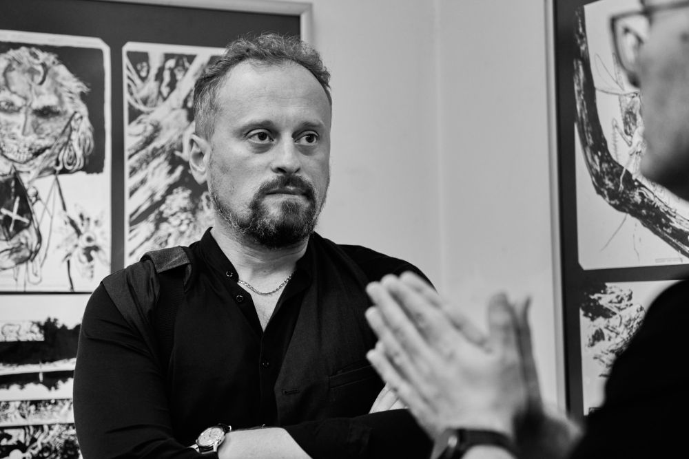 Stevan Subic in front of his work