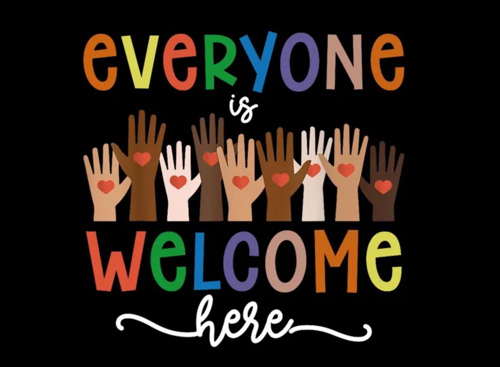 The words “Everyone is welcome here” in various colors and differing shades of human hands, each with a heart in the palm, on a black background. 