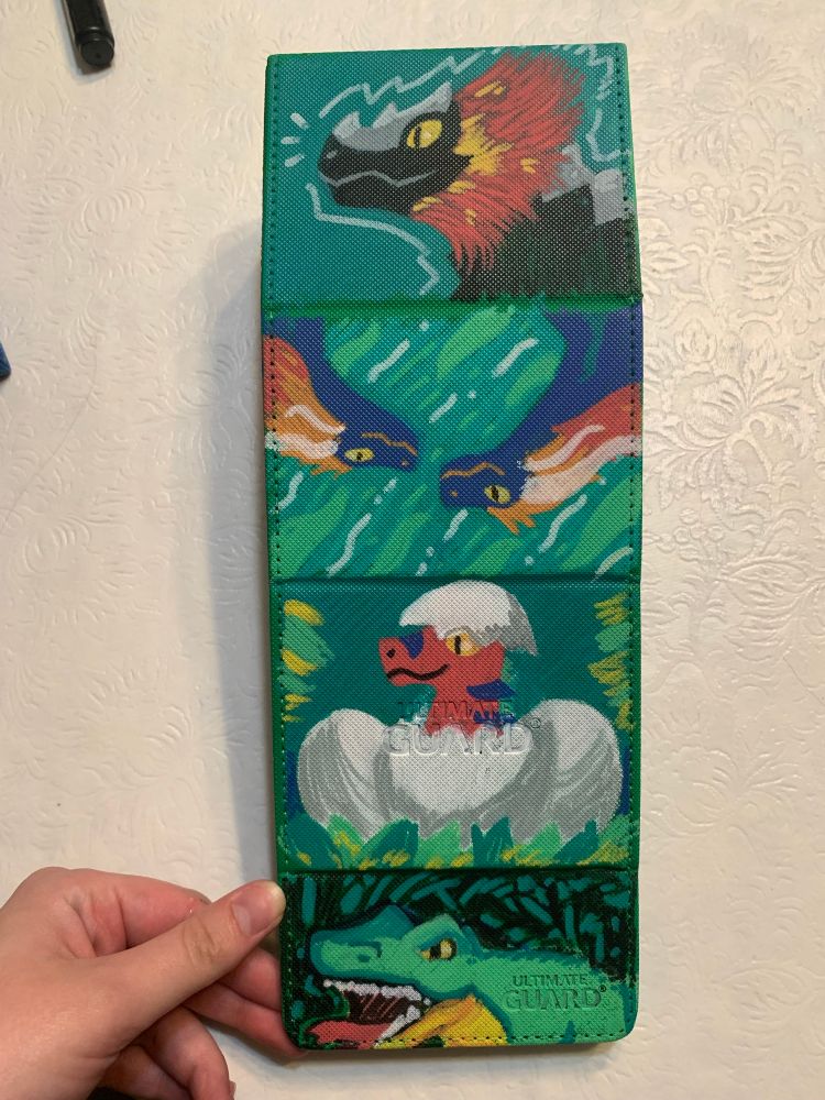 hand painted illustrations featuring various dinosaurs on a deck box