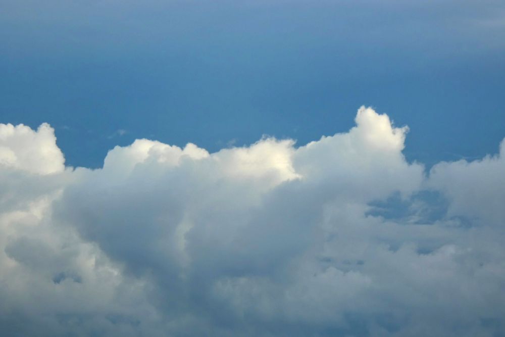 White clouds under a blue sky.