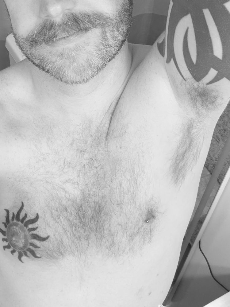 Black and white photo of hairy gay show hairy pit in selfie 