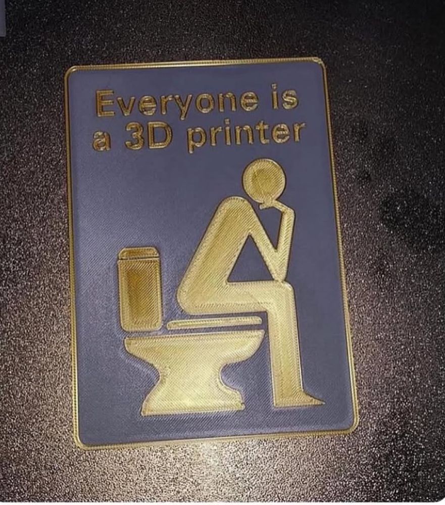 A sign of a person sitting on a toilet with text saying, 