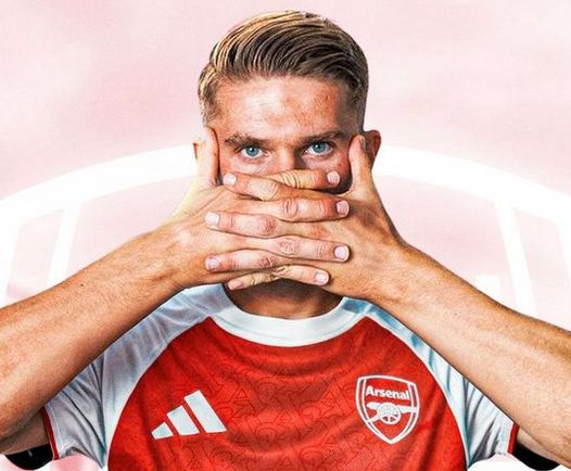 A photo of Viktor Gyökeres performing his patented mask goal celebration while wearing an Arsenal shirt