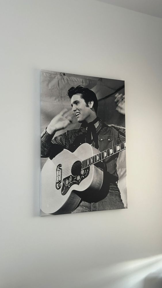 Black white portrait of Elvis Presley at a show