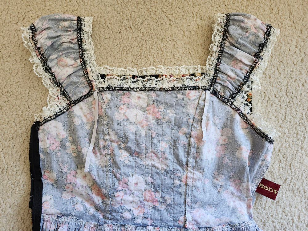 The inside of the altered jsk, showing the amount of elastic I pulled out to tighten them to the correct size. About 4 inches of elastic on one side, 6 on the other.