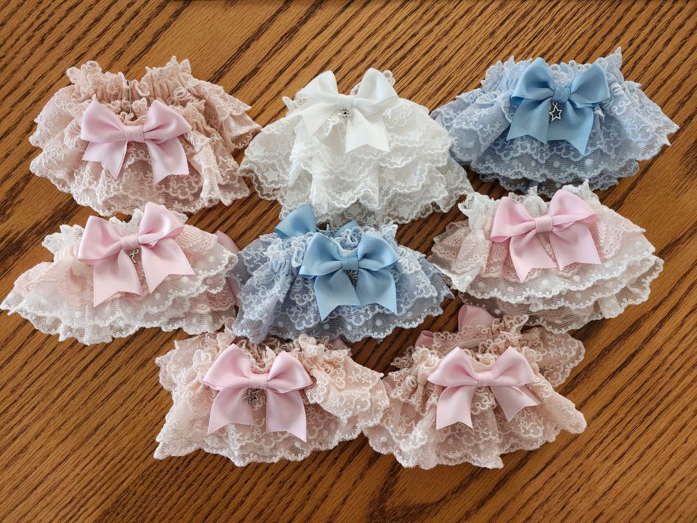 8 pairs of lolita wristcuffs in multiple colours, including pink, sax blue, white, and pink/white