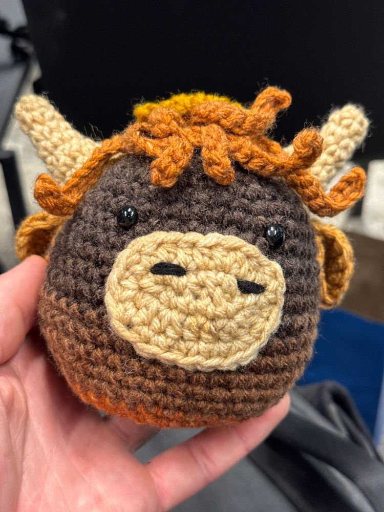 a cute hand knit yak plush