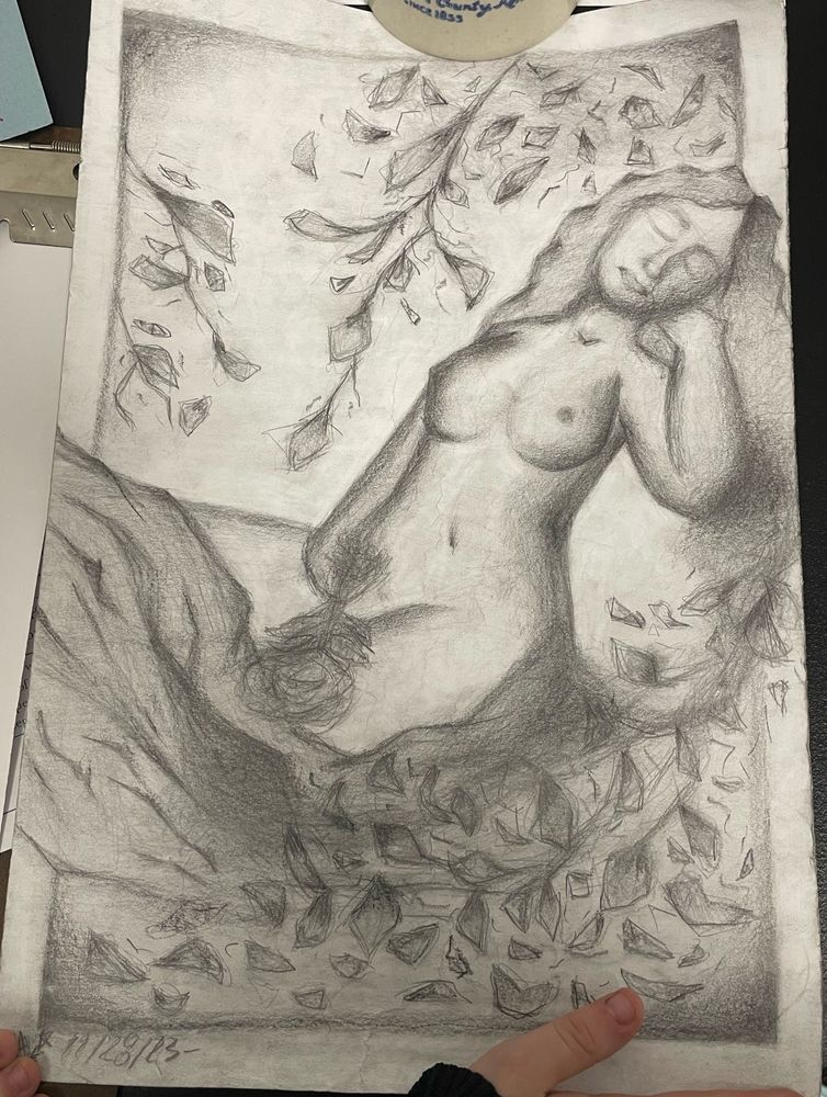 drawing of a naked lady laying down on a rock 