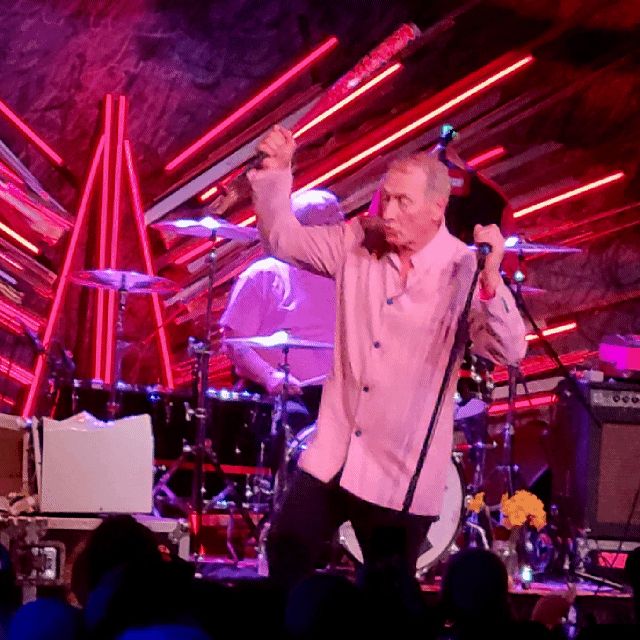 Jon King hitting a microwave with a baseball bat at the Gang of Four concert at Sony Hall in NYC. 