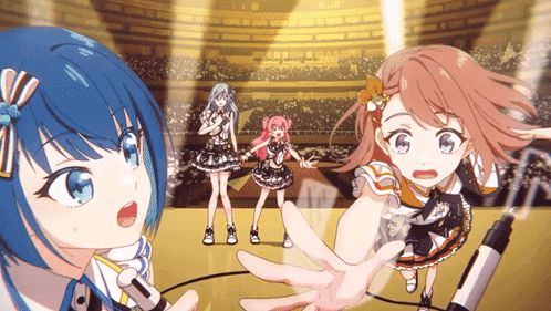 a group of anime girls are singing into microphones