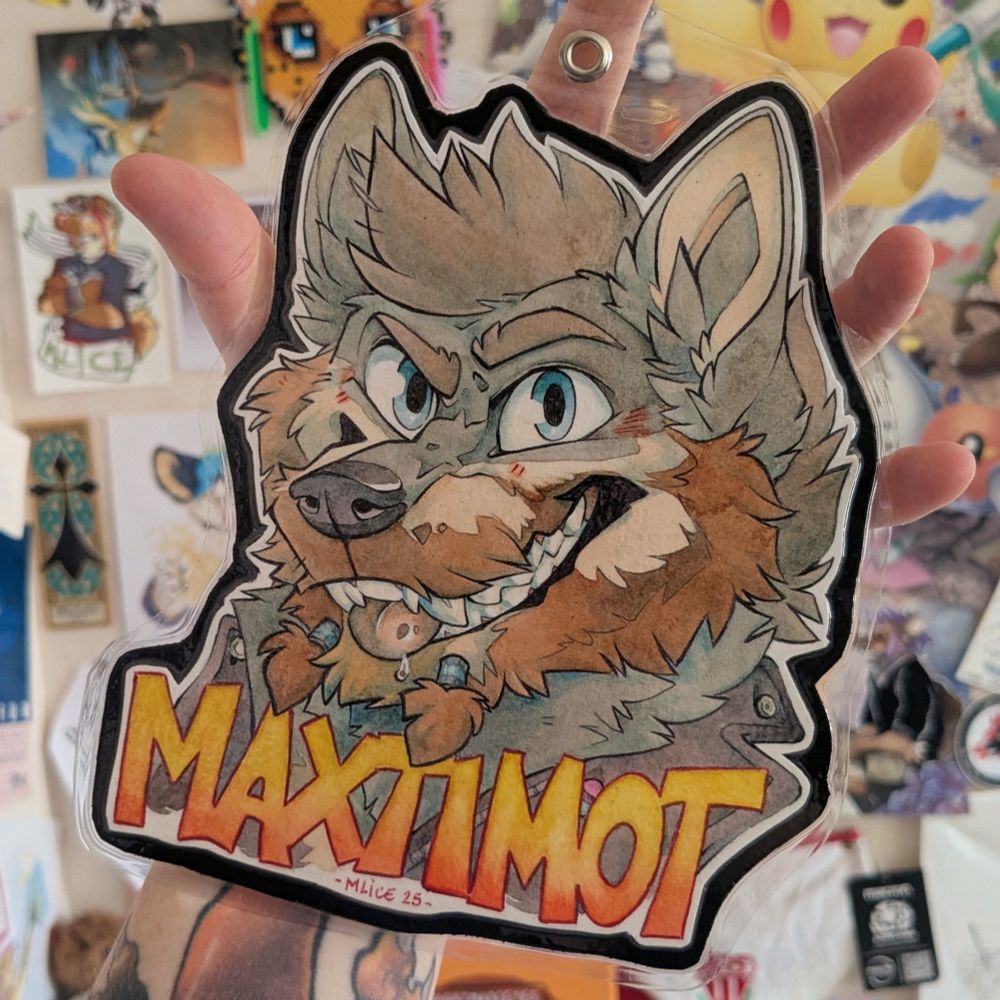 Watercoloured convention's badge commission for Maxtimot, a grey wolf with a big beard