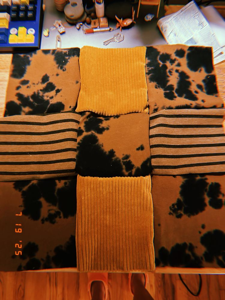 the squares from the first picture sewn together in a 3x3 grid! it’s not very well done but it’s the first time i have sewed anything with a machine in like 15 years.