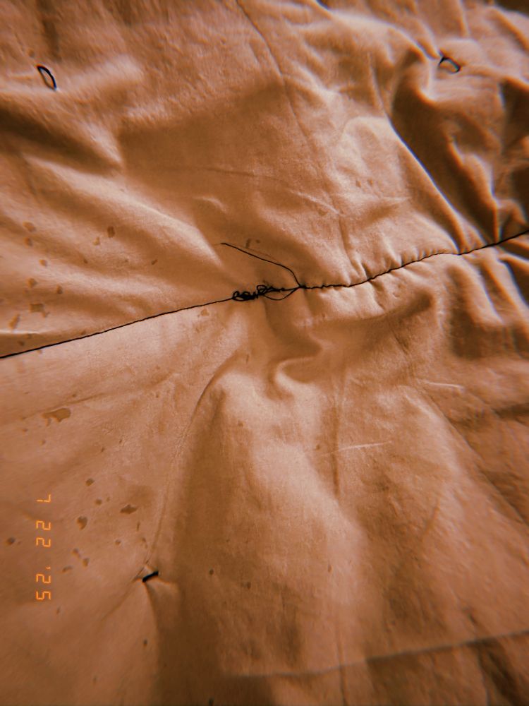 big thread snarl on the backside of my quilt, and yucky yucky stains from the spray adhesive i used. damn