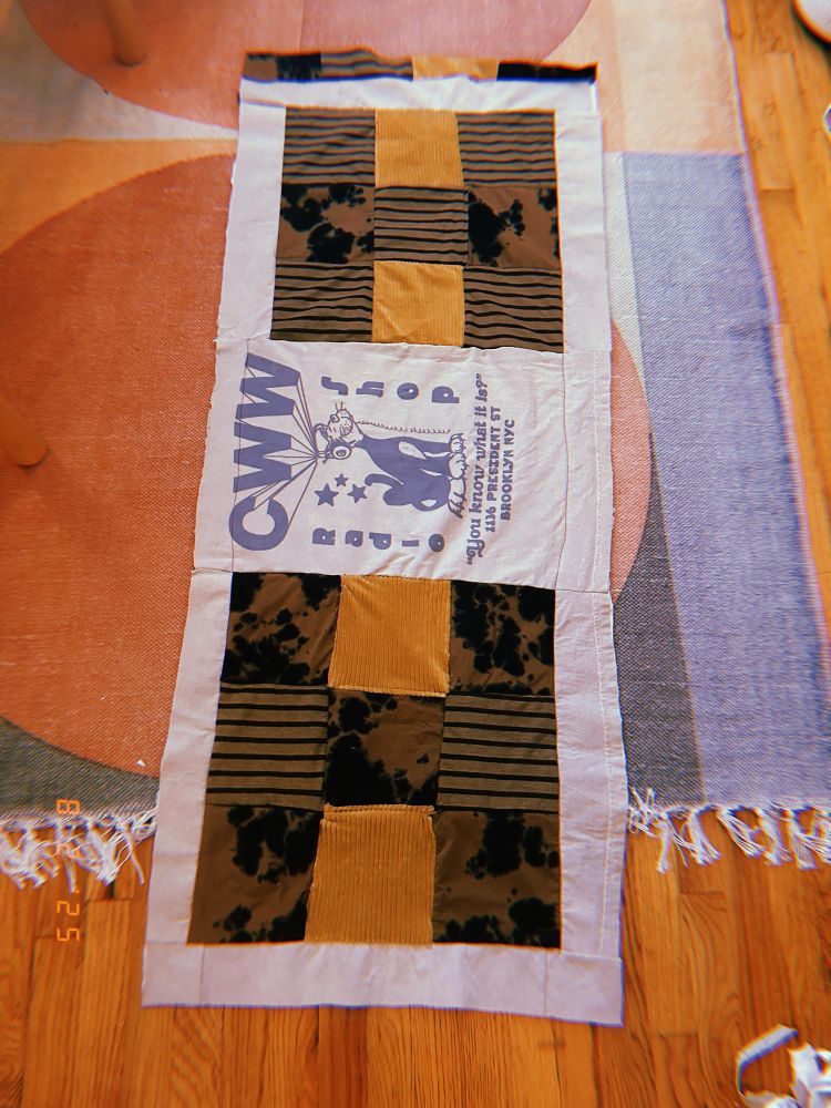 this is the latest WIP shot of my quilt. i had to add a weird crooked strip of bullshit to one end, and the “grid” is egregiously uneven. xoxo