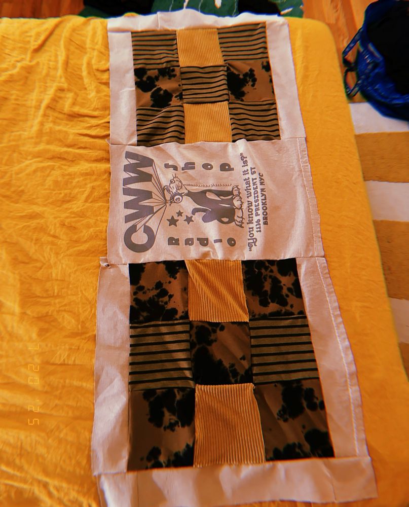 the full piece is assembled. but it is merely a quilt husk, until i attach batting and stitch some kind of nice pattern onto it. 