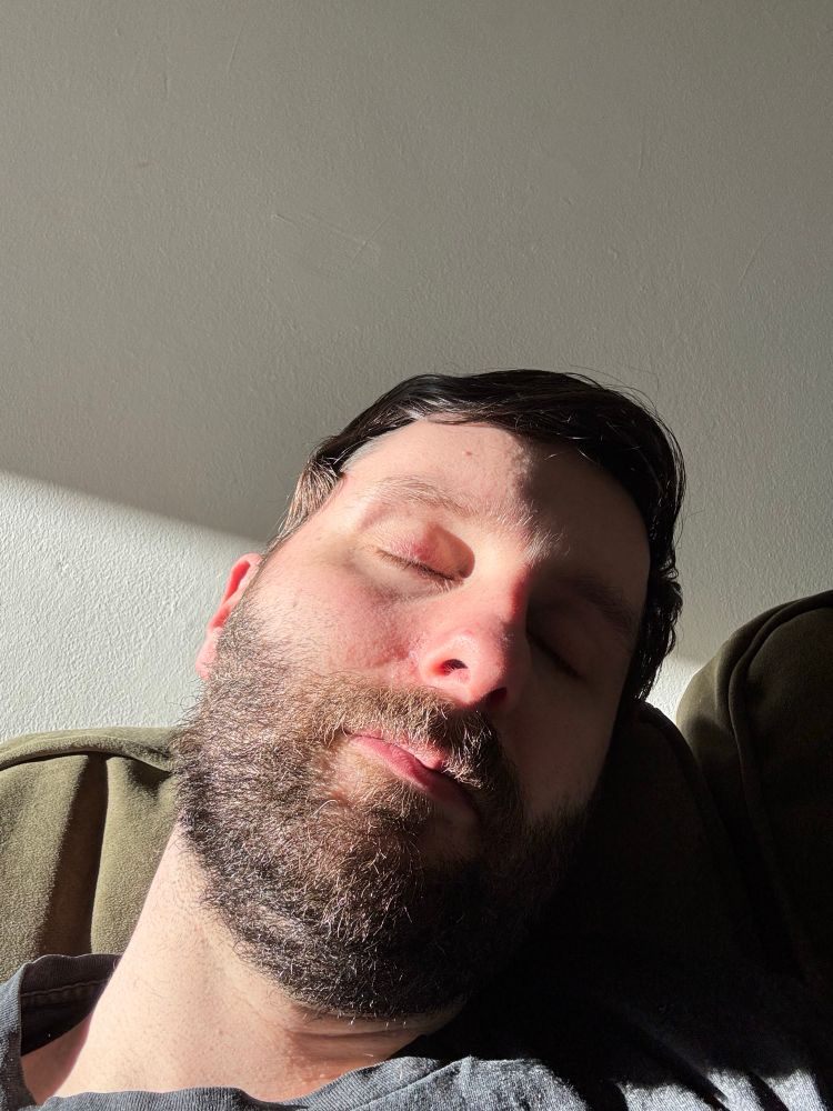 Sunshine glistening off the right side of my head as I close my eyes. Also watching rugby off screen