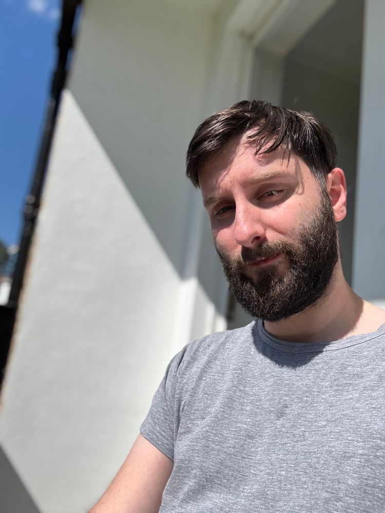 Me sitting in the sun on my veranda. Not a cloud in the sky