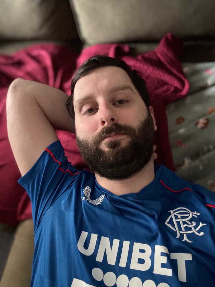 Wearing an Association football top (Soccer for Americans followers) resting after the result