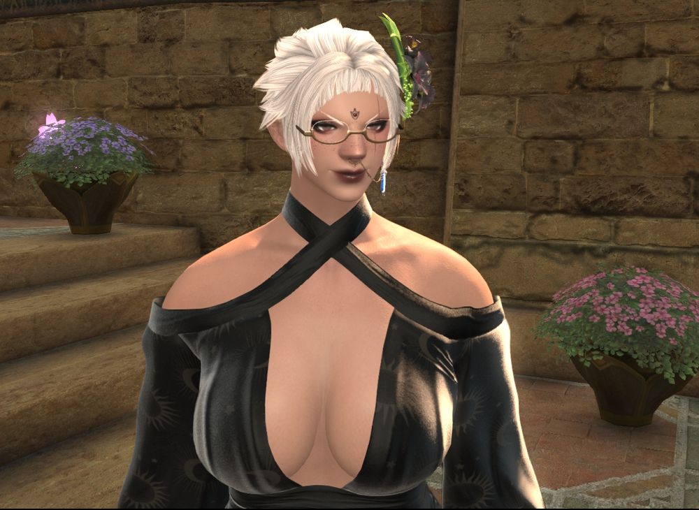 Keen Sparrow, a black female Roegadyn woman with light skin and choppy hair. She wears glasses, eyeshadow, lipstick, and a gold nose piercing and chain connected to a earring. She wears a generous low cut black dress and a dark flower corsage in her hair.