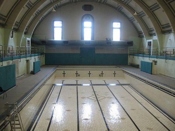 Haggerston Swimming Pool, also known as Haggerston Baths, has been closed since 2000. It was initially closed for emergency repairs (at same time as a Clissold pool mega overspend)but has remained shut ever since. The Grade II-listed building has faced challenges in securing funding for its restoration and reopening as a swimming pool. While there were initial plans to restore the pool with community facilities and a GP surgery, these were ultimately scrapped due to funding issues