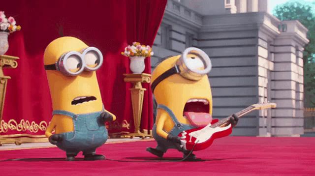 two minions singing and one playing a guitar