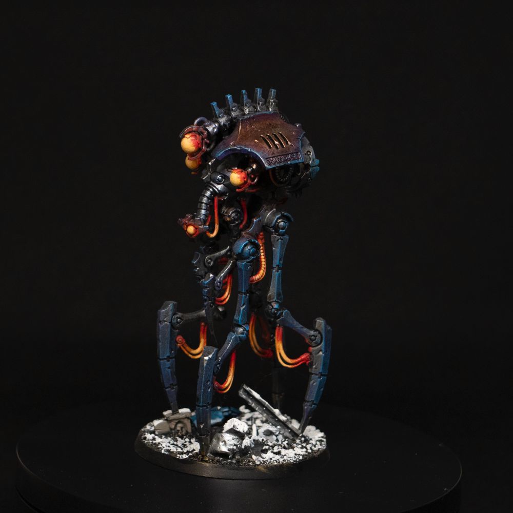 Necron reanimator Warhammer 40K with blue metal and red glow