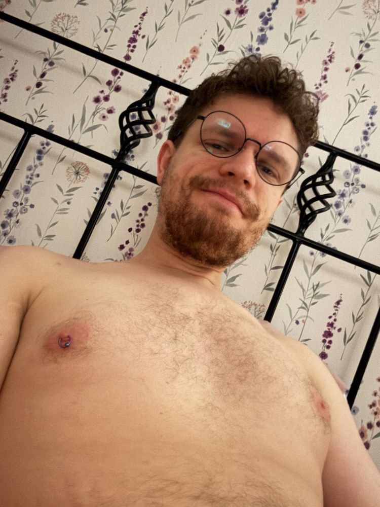 A shirtless photo of me w my round glasses on