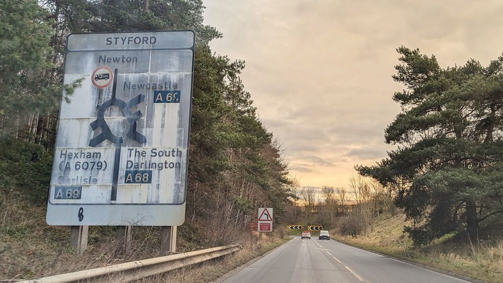 An original sign approaching the Corbridge Bypass on the A69. It's unusual for having a pre-1981 "tons" roundel as well as having a junction name specified - these weren't formally introduced into the regulations until 1994.