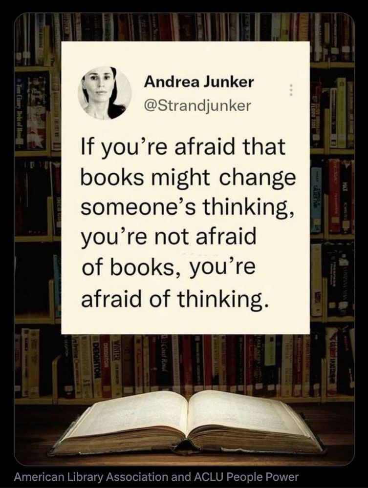 A color photo of an open book on a table in front of bookshelves filled with various books, above the book is a card that reads, "If you're afraid that books might change someone's thinking, you're not afraid of books, you're afraid of thinking." ~Andrea Junker