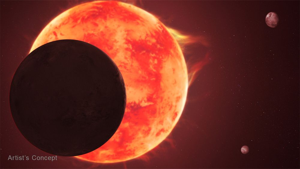 Illustration of a planet silhouetted in front of a star. The star shows a large eruption on one side, near 2 o’clock, and more wisps of red coming from its southern hemisphere. Two more planets appear in the background at right. The words “Artist’s Concept” are at the bottom left.