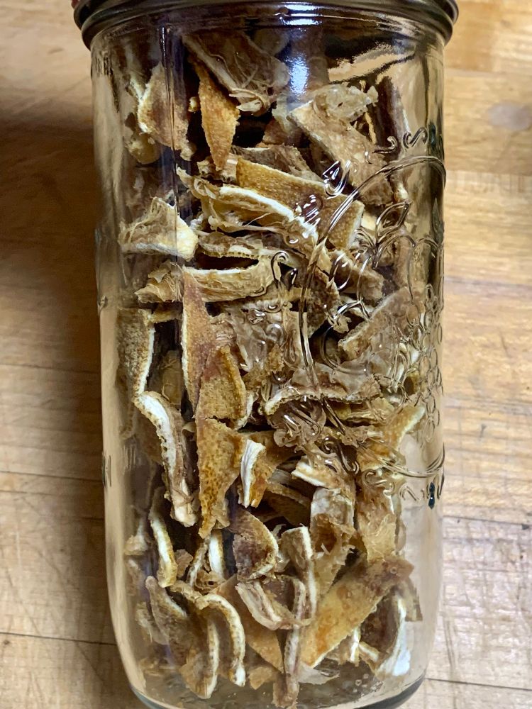 Dried yuzu peels in a mason jar. They turned a khaki bamboo color. 
