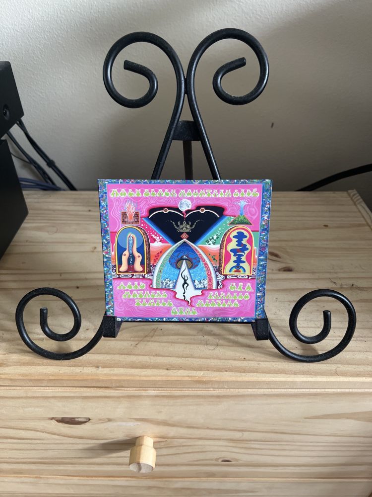 Gatefold digisleeve packaging of compact disc issue of Acid Mothers Temple & The Melting Paraiso U.F.O.'s 'Holy Black Mountain Side' (Rolling Heads, 2024 - r. 2025).